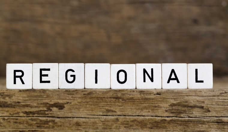 The word regional written in cubes on wooden background