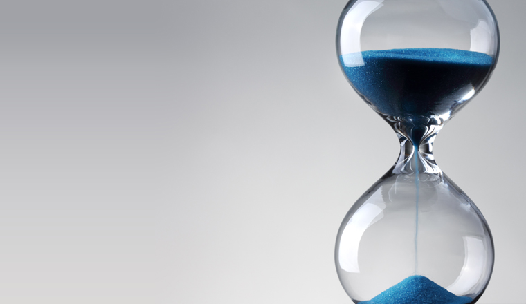 Time passing. Blue hourglass.