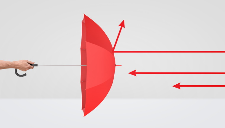 A male hand holding an open red umbrella while red arrows strike on it. Protection from adversary. Competitors traps. Hostile market.
