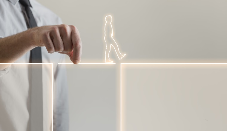 Businessman holding glowing bridge passage line to help outlined image of man walk across the gap, business assistance concept.