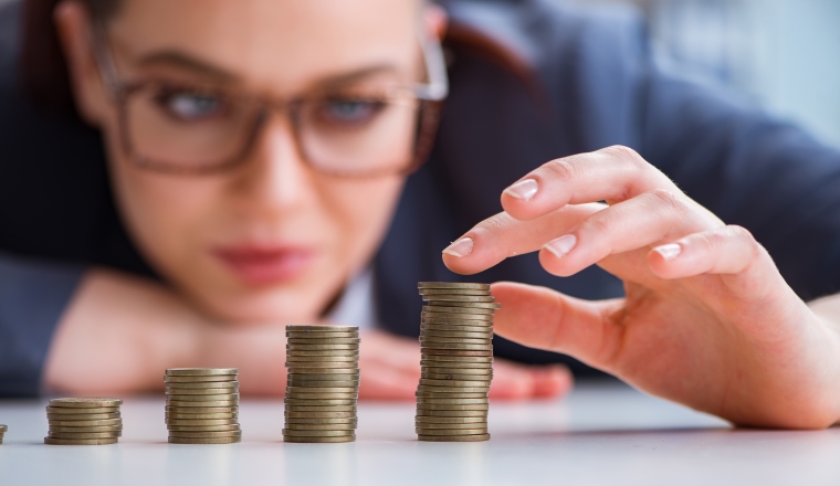 Businesswoman with coins in forex concept
