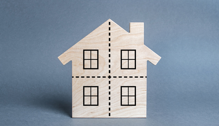 Residential building divided by a dotted line into four equal parts. Divorce concept. Disputes over division process of real estate and property after divorce. Distribution of the right