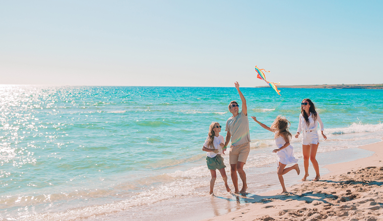 Happy family on a beach during summer vacation