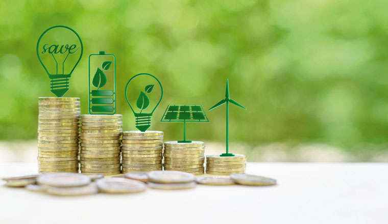 Alternative or renewable energy financing program, financial concept : Green eco-friendly or sustainable energy symbols atop five coin stacks e.g a light bulb, a rechargeable battery, solar cell panel