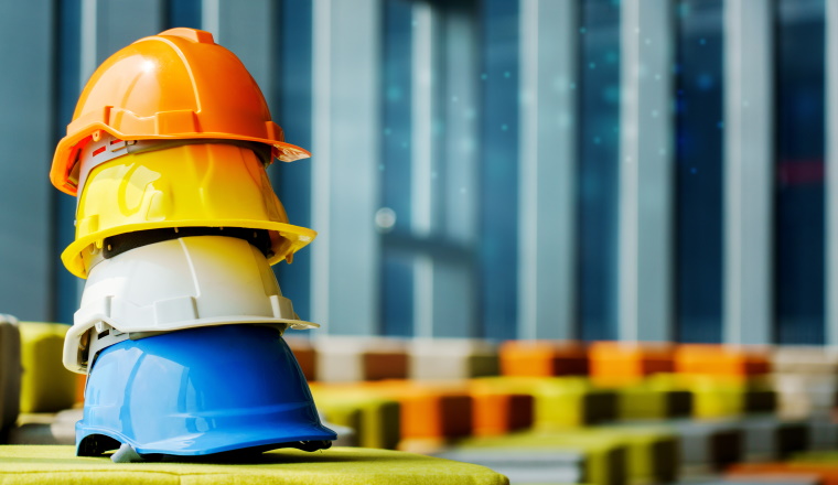 Hard Hat Construction for worker or engineer wearing prevent or safety working in dangerous area Such as construction sites, industry, factory and warehouses. Concept Contractor work agreement