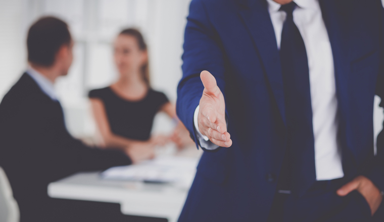 Closeup of a business handshake .