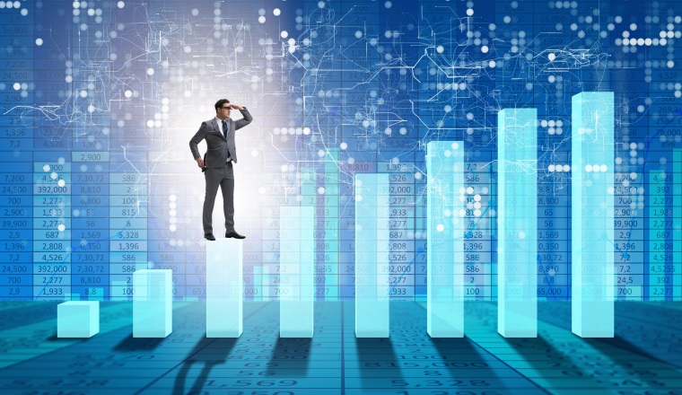Businessman looking far in economic forecasting concept