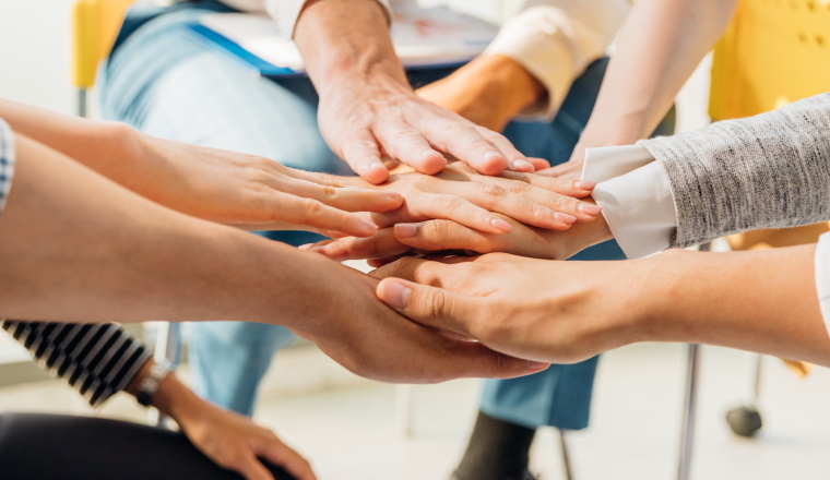 Panoramic teamwork business join hand together concept, Business team standing hands together, Volunteer charity work. People joining for cooperation success business.