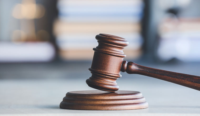 Judge's gavel on table in office