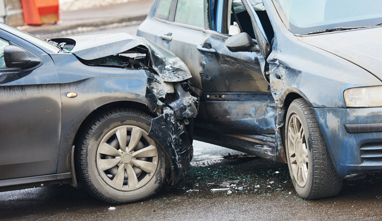 Car crash accident on street with damaged automobiles after collision