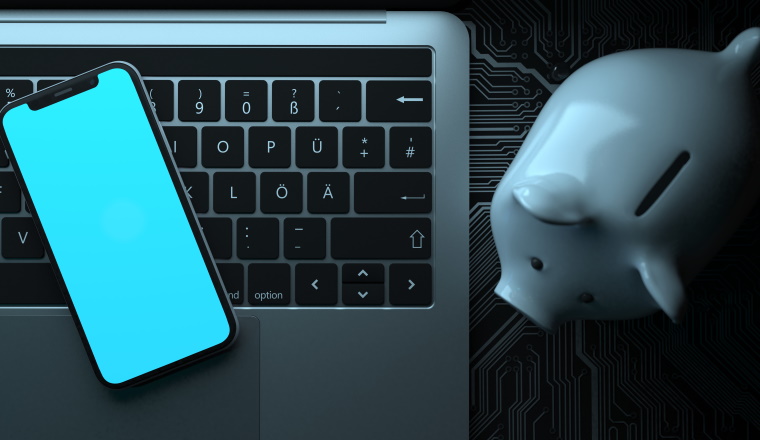 Smartphone and Notebook with white piggy bank on the circuit board. 3d illustration.
