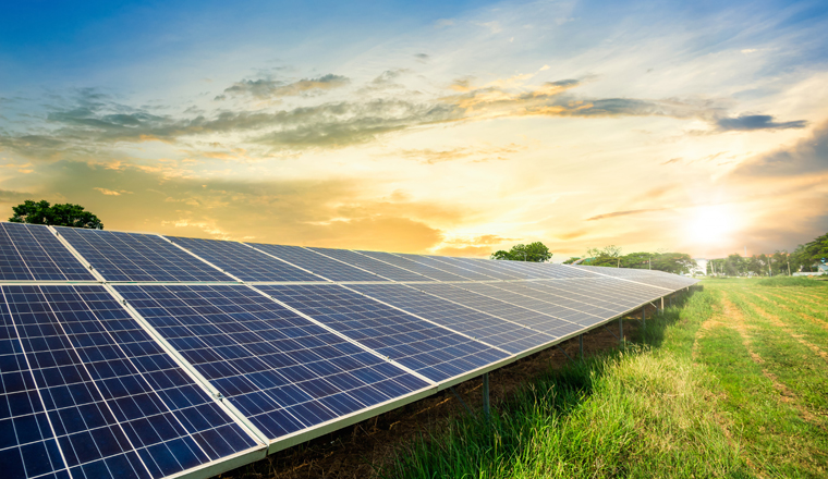 Solar panel cell on dramatic sunset sky background,clean Alternative power energy concept.