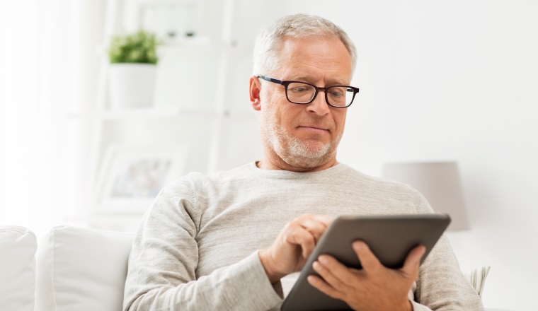 technology, people and lifestyle, distance learning concept - senior man with tablet pc computer at home