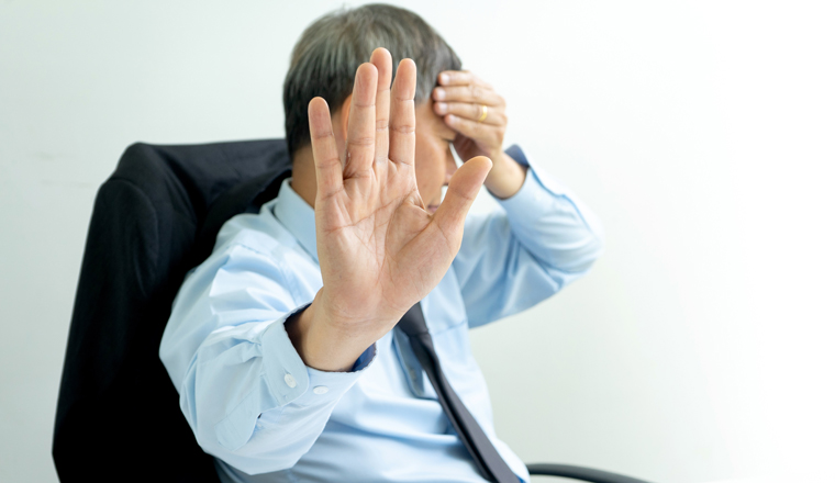 businessman sit at the table fill sad and headache , concept business failure or problem