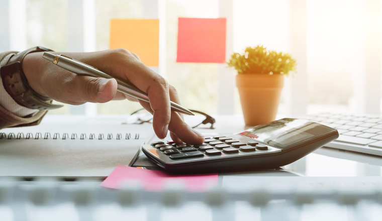 Close up view of bookkeeper or financial inspector hands making report, calculating or checking balance. Home finances, investment, economy, saving money or insurance concept