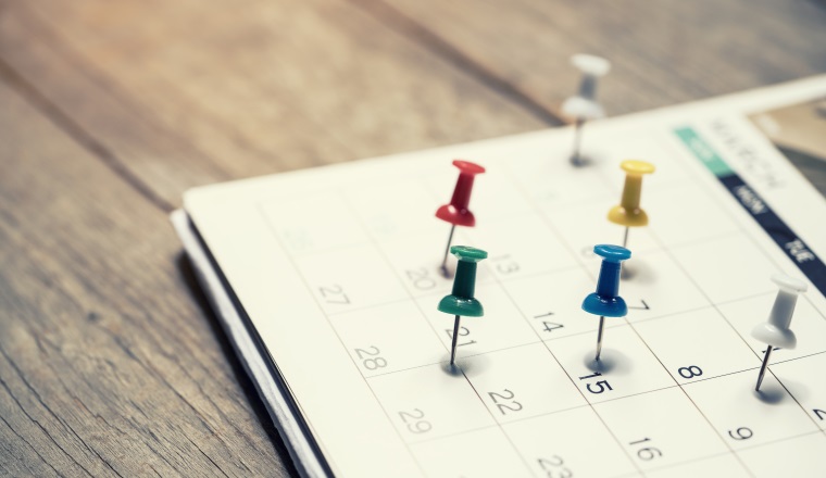 close up of calendar on the table, planning for business meeting or travel planning concept