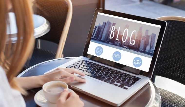 woman reading blog online on computer
