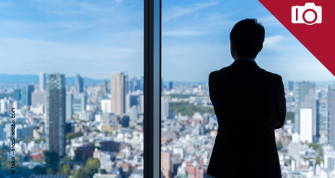 Young businesswoman in suit and mask ready to jump in water